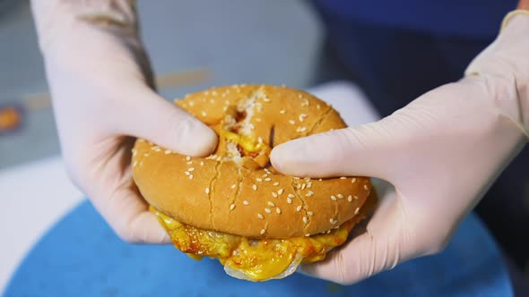 Fast food. Macro view of breaking burger. 