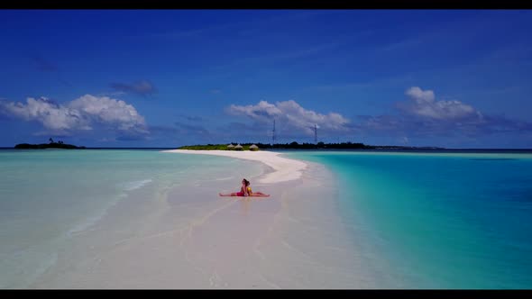 Boy and girl sunbathe on exotic sea view beach voyage by transparent water and white sandy backgroun