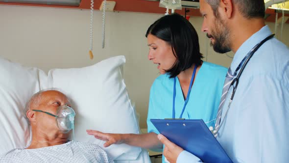 Doctor and nurse interacting with patient