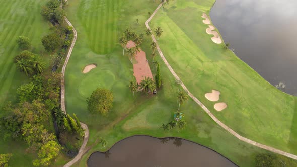 4K Aerial view Top-down view of Lawn Golf course in the morning or evening light, beautiful green