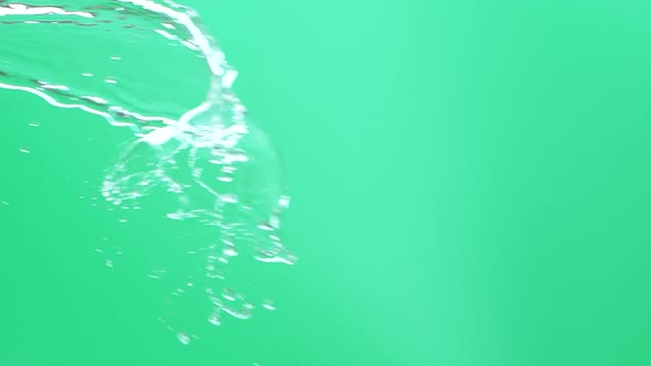 Slow Motion of Water Spash with Drops Over Green Screen Chroma Key Background