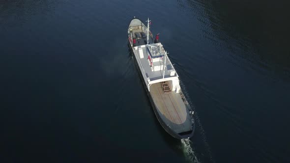 Overhead Drone View of a Ferry Arriving at a Dock on a Fjord in Norway