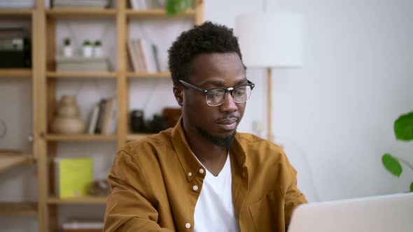 Businessman Working with Laptop and Sitting at Table at Home During Pandemic Spbas