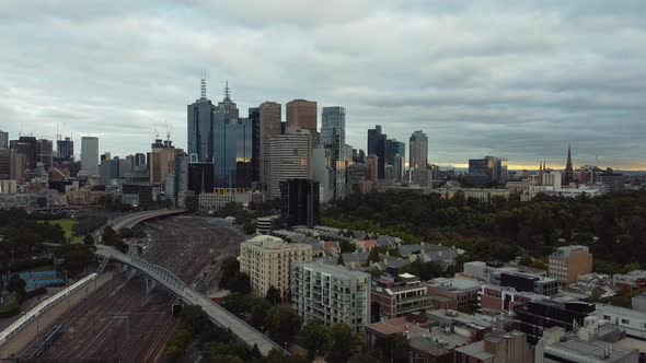 Drone shot of Melbourne, Victoria in coronavirus lockdown - a sweeping scene of the skyline at sunse