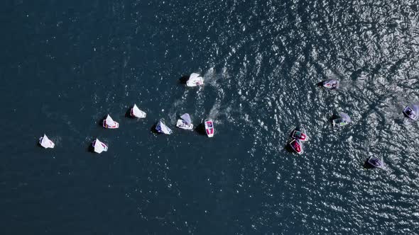 Regatta of small boats on the lake in summer