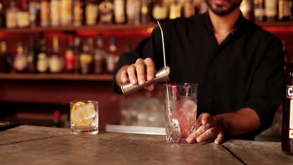 Bartender mixing cocktail