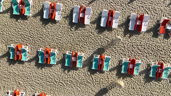 Empty sun loungers on the beach aerial view 4 K Turkey Alanya