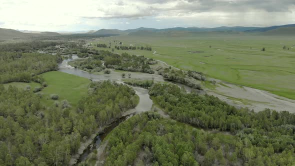 Trees, Forest and Vast Meadow in The Big River in Wide Valley of Asia Geography