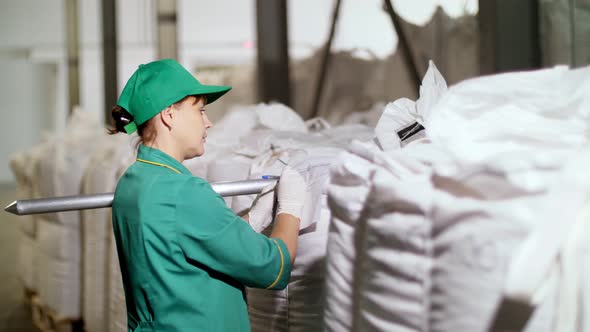 CHERKASY UKRAINE AUGUST 24 2018 Woman Employee of Agricultural Enterprise Fills Out Paper Sheets on