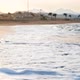 Beautiful Slow Motion Footage of Ocean Waves Rolling on the Sandy Beach at Sunset Light - VideoHive Item for Sale