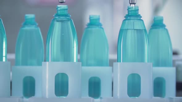 The new plastic bottles on the conveyor belt at the drinking water factory.