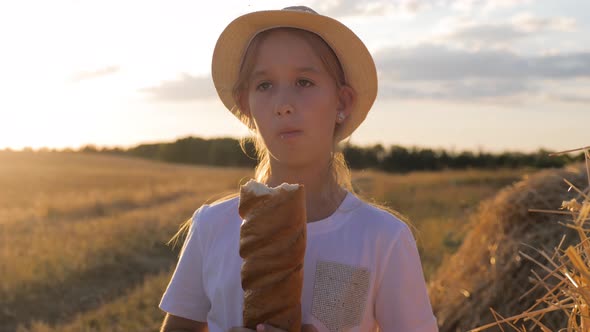 Hungry Child Eating Bread in Wheat Field Summer Outdoor Lifestyle