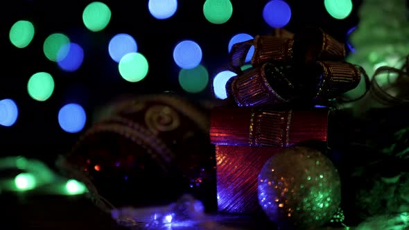 Gift Box And Christmas Ball With Blinking Bokeh Lights