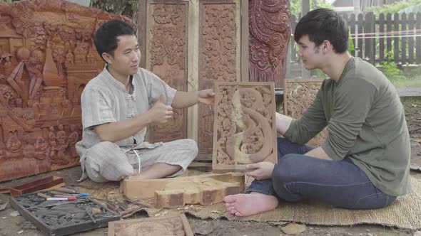 Teacher Thumb Up To His Student After Finished Carving Wood