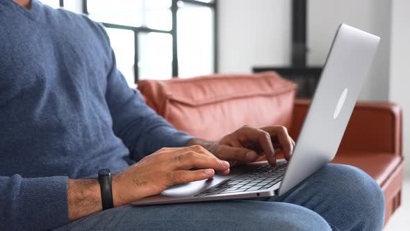 Close Up Image of Male Hands Typing Text on the Laptop Keyboard Working