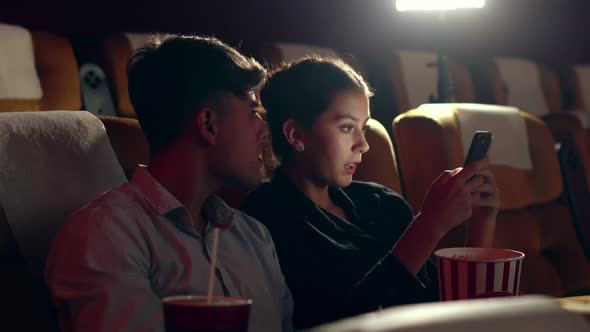 Woman Playing Games on Mobile Phones