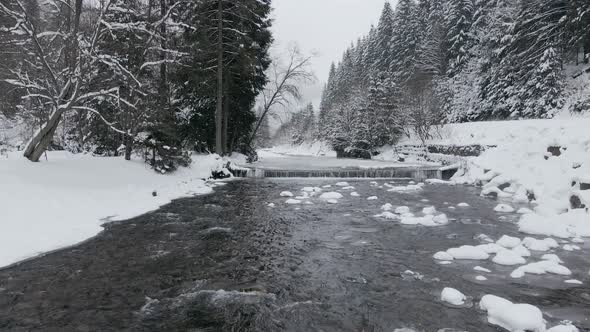 Aerial  View Drone Moving Above the Frozen River in Mountains