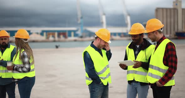 Multiracial people working together at industrial port outdoor