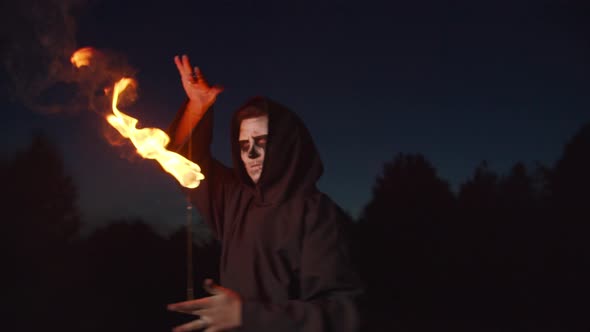 Spooky Grim Reaper Juggling Fireball at Night