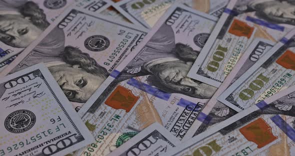 American Money with Currency One Hundred US Dollar Banknotes Closeup on a Table