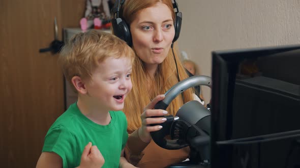 Boy With Mother Playing Racing