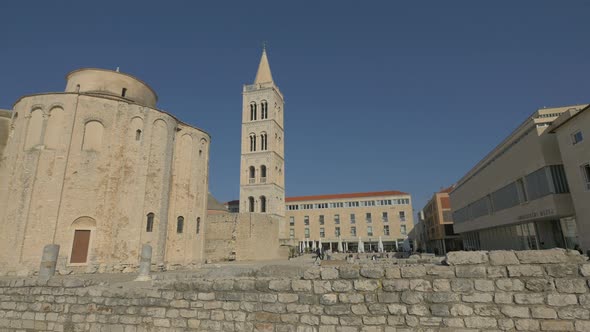 Ruins and churches in a sunny square