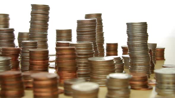 Camera Moves Past Stacks Of Coins