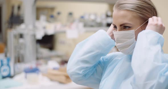 Scientist Wearing Protective Mask at Laboratory alt