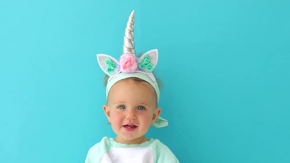 Funny Unicorn Little Girl on Blue Background