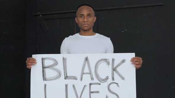 Poster BLACK LIVES MATTER in the Hands of a Black Man