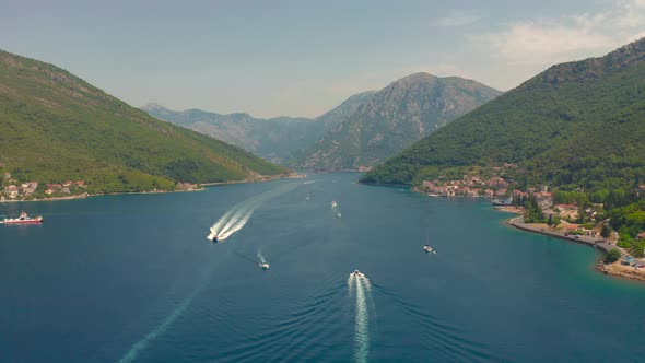 A Motor Boat Cuts Through the Water in the Bay of Kotor in Montenegro