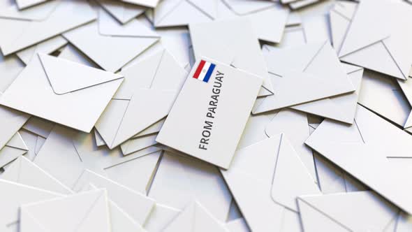 Letter with From Paraguay Text on Pile of Other Letters alt