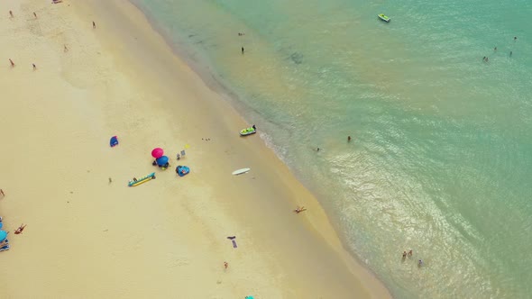 Flying along Karon Beach and the tourist area on the island of Phuket in Thailand, the Indian Ocean