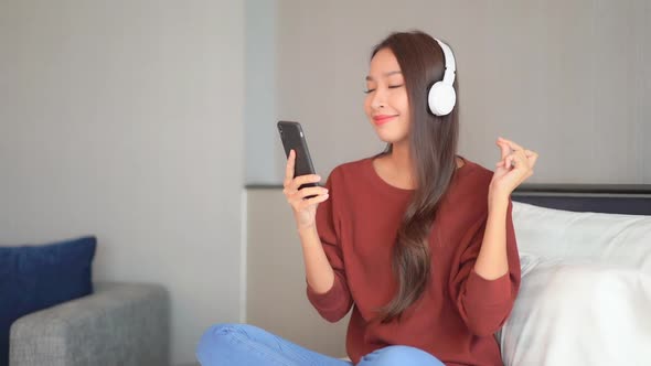 Woman use smart phone for listen music