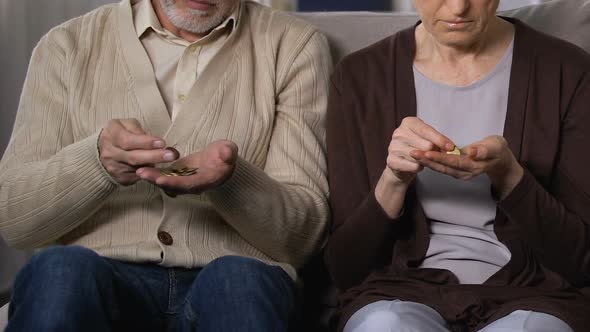 Upset Aged Couple Counting Money, Social Insecurity, Helplessness and Poverty