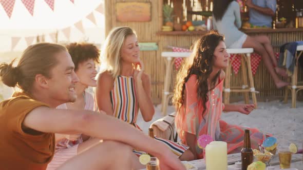 Friends people enjoying a party on the beach