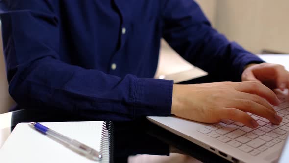 Male Freelancer Working on Laptop at Homeoffice