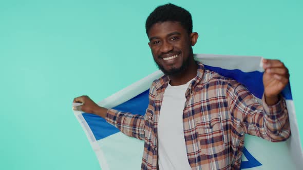 Man Waving and Wrapping in Israel National Flag Celebrating Independence Day on Gray Background