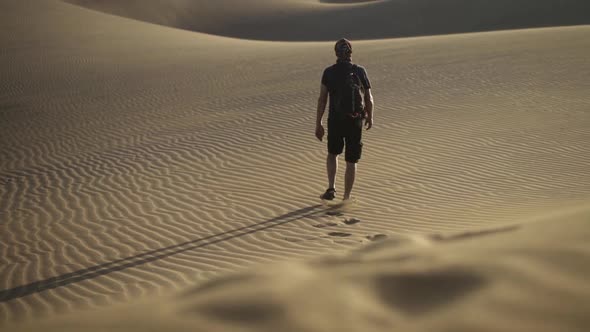 Footprints Of Man Walking In Desert