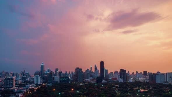 Day and night transition time lapse of cityscape and buildings in metropolis