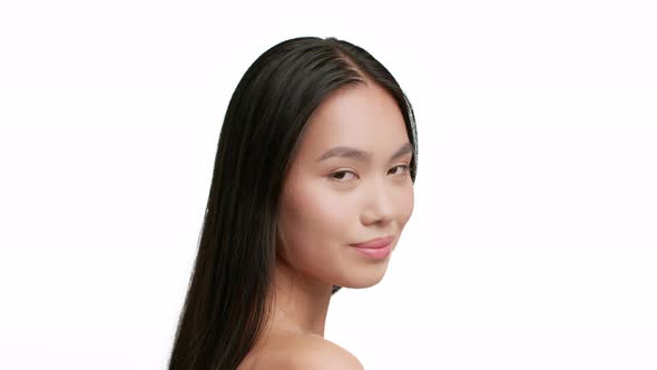 Portrait Of Attractive Asian Lady With Brunette Hair White Background