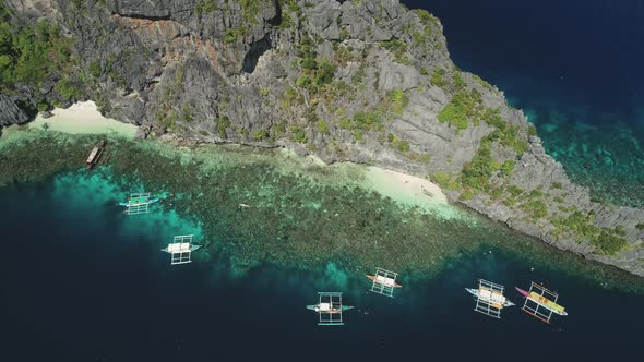 Boats at Cliff Ocean Shore Sand Beach at Coast Aerial View