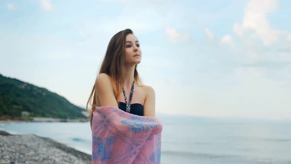 Beautiful Thinking Woman Walking Along the Coastline