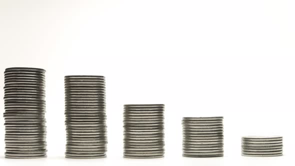 Silver Coins on Stacks Are Decrease on White Background Stop Motion Animation