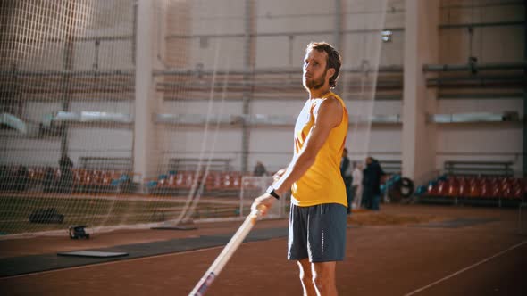 Pole Vaulting - Man Is Configuring To Jump