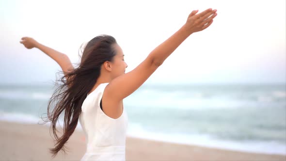 Asian woman enjoy around beautiful beach sea ocean