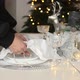 Woman hands decorating and serving festive table for the Christmas holidays. - VideoHive Item for Sale