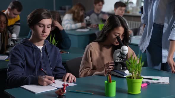 Diverse Teenage Students Working in Biology Lesson