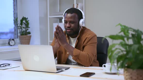 African Man with Headphones Say Goodbye to Video Camera Spbas