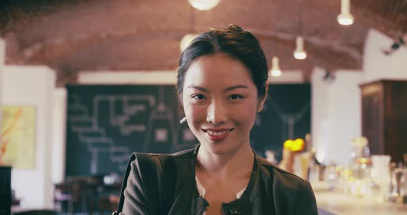 Close Up Confident Young Asian Woman Serious and Smiling Portrait